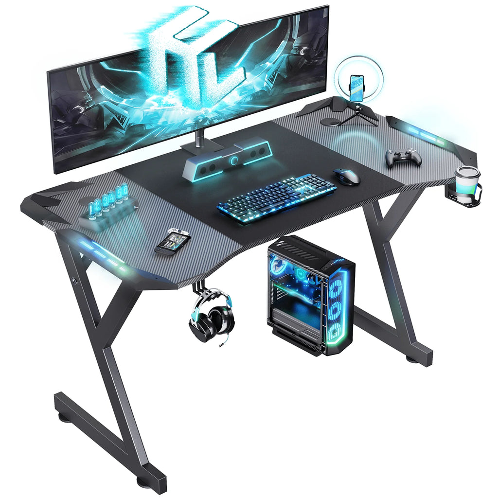 HLDIRECT 47 Inch Gaming Desk with LED Lights, Ergonomic Computer Gaming Table with Carbon Fibre Surface, Sturdy PC Workstation Desk for Gaming and Home Office with Headphone Hook, Cup Holder, Black