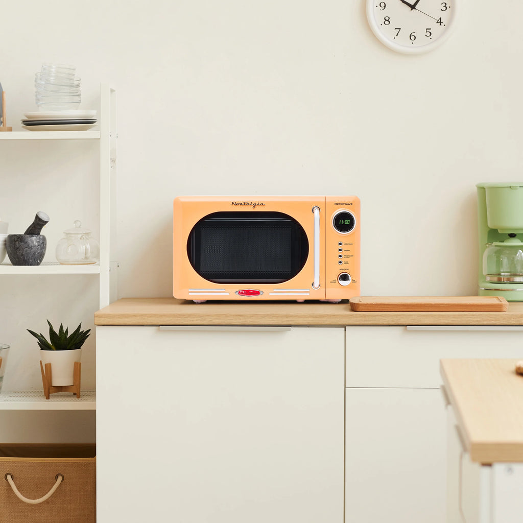 Nostalgia Retro Compact Countertop Microwave Oven - 0.7 Cu. Ft. - 700-Watts with LED Digital Display - Child Lock - Easy Clean Interior - Orange